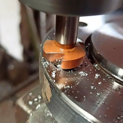 Close-up of All In One Countersink Set 6 Pc 90 Degree Chamfer Bits in use on metal surface for smooth chip flow.