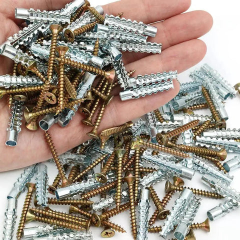 10 Pieces Carbon Steel Drive Anchors With Screws Tree Shaped Hollow Wall Anchors For Drywall And Furniture Repair Durable Metal Expansion Screws 3.5 Cm Length For Stronghold And Long Lasting Installations scattered on a hand and table.