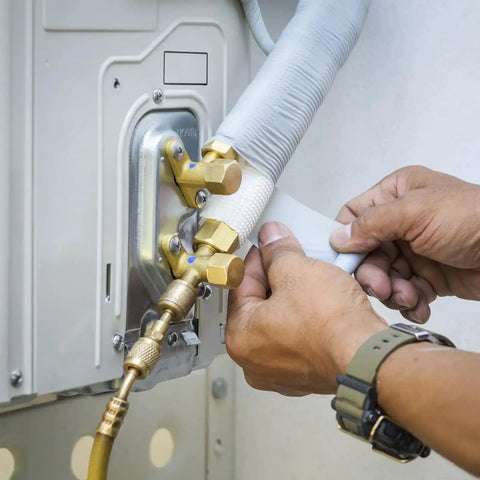 Applying Pipe Wrapping Tape 4.7 Inch by 49.2 Feet, PVC Duct Tape on air conditioner piping for waterproof insulation.