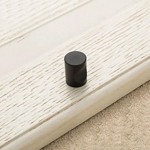 12 Pcs Cylindrical Cabinet Handles And Mini Drawer Pulls In Black For Cabinets Wardrobes Drawers And Jewelry Boxes 0.7 By 0.9 Inch Knobs Sturdy Zinc Alloy Construction Space Saving Hardware With Subtle Modern Minimalist Style on cabinet door