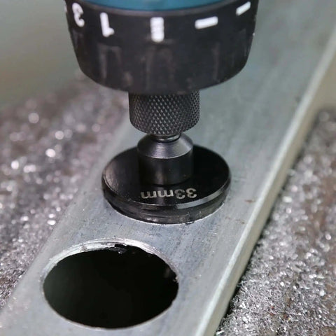 Close-up of drill using Beefy Bi-Metal Hole Saw Kit 3-Piece Set 7/8 to 1-3/8 Inch M42 Cobalt Teeth on metal surface