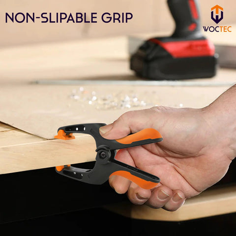 WOCTEC 6-inch heavy-duty spring clamp, black and orange plastic grip, ideal for woodworking and gluing
