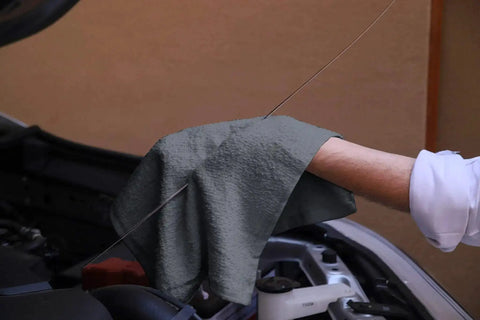 Pack Of 60 14 By 17 Inch Bar Towels For Cleaning 100 Percent Cotton Absorbent And Reusable Multipurpose Terry Cloth Shop Rags Gray Great For Heavy Duty Cleaning Spills And Damp Surfaces In Home Garage And Workshop being used on a car engine.