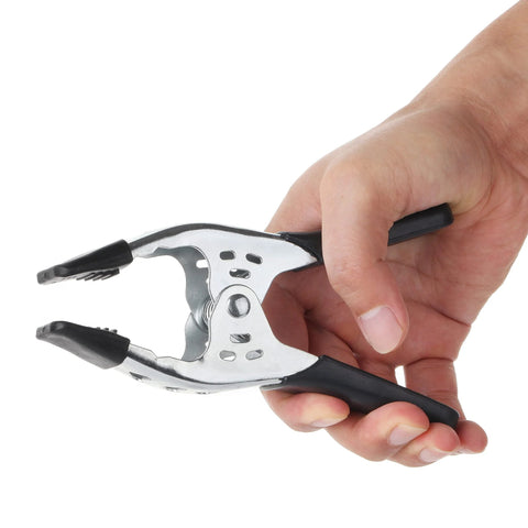 Mr. Pen 6-inch metal spring clamp with black handles held in hand