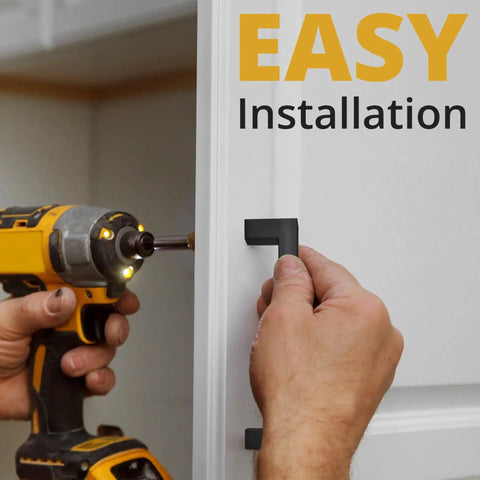 Installing Matte Black Cabinet Pulls 25 Pack, 5.5 Inch Length With 5 Inch Hole Spacing on a white cabinet door with a screwdriver.