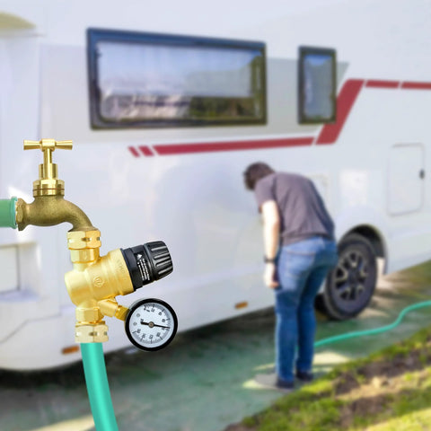 STMOUTUO RV water pressure regulator, brass, 0-160 PSI gauge, filter, connected to green hose.