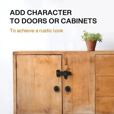 Vintage Style Black Wrought Iron Flip Latch Hardware Kit For Double Doors on wooden cabinet with plant on top.