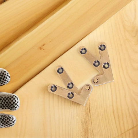 Hidden Door Pivot Hinges Two Pack Invisible Concealed Hardware for Bookcase and Cabinet Doors on wooden surface