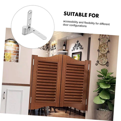 Stainless steel pivot hinge next to brown wooden saloon door in a modern room.