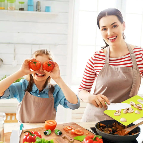 Mother and daughter using Real Kitchen Skills For Little Chefs 13 Piece Toddler Knife Set With Wooden And Plastic Knives in kitchen