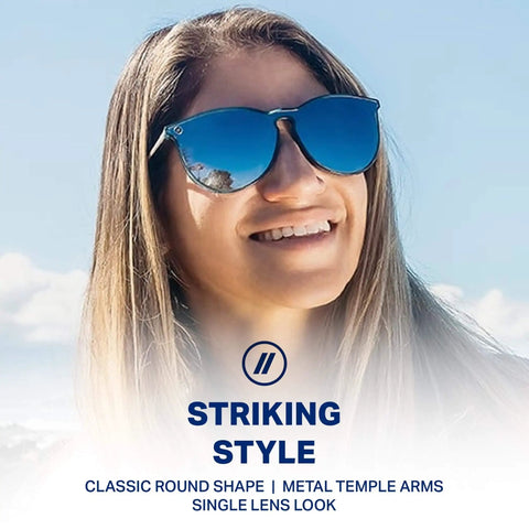North Park X2 Polarized Sunglasses With Classic Shape And Mixed Metal Frame Gray Lenses Crystal Blue Frames And Silver Temples 100 Percent UV Protection For Men Dope Edge, worn by a woman outdoors.