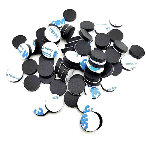 Half Inch Wide Round Silicone Rubber Bumper Feet Pads One Eighth Inch Thick With Adhesive Backing scattered on white background