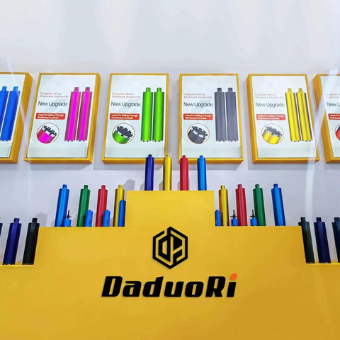 Display of colorful drill bit kits in packaging, featuring multiple colors and box arrangements with DaduoRi logo.