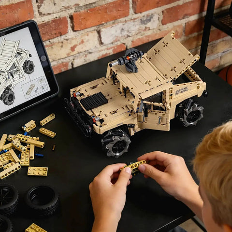 Off Road Hummer Armor RC Car Kit With 804 Pieces For A Technic Style Build on desk, child assembling with instructions