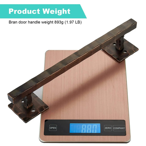 Rustic 12 Inch Heavy Duty Barn Door Handle Pull For Sliding Doors Solid Metal Construction With Oil Rubbed Bronze Finish Large Design For DIY Barn Doors Gates Sheds And Garages All Weather Ready shown on a scale weighing 893g.