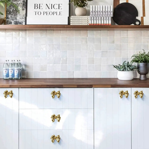 Kitchen cabinets with Gold Bow Cabinet Knobs Set Two Pack Brass Finish Bow Shaped Pulls for drawer and door handles, completed view.