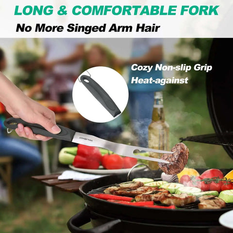 A person using a long fork from the Heavy Duty BBQ Tool Set With Spatula, Fork And Tongs In Premium Stainless Steel, grilling meat outdoors.