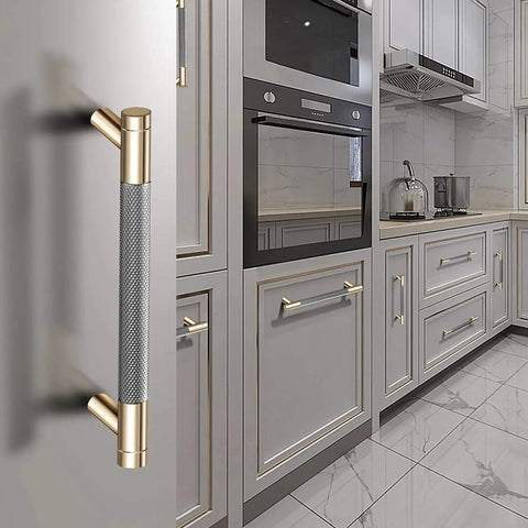 12 Pack 3 Inch Barrel Cabinet Pulls Gold And Grey Aluminum Handles For Cabinets And Drawers in a kitchen setting