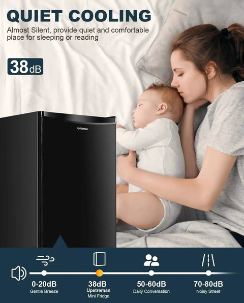 Mother and child sleeping next to a black 3.2 Cu Ft Single Door Mini Fridge With Freezer For Dorm Office Bedroom, emphasizing quiet operation.
