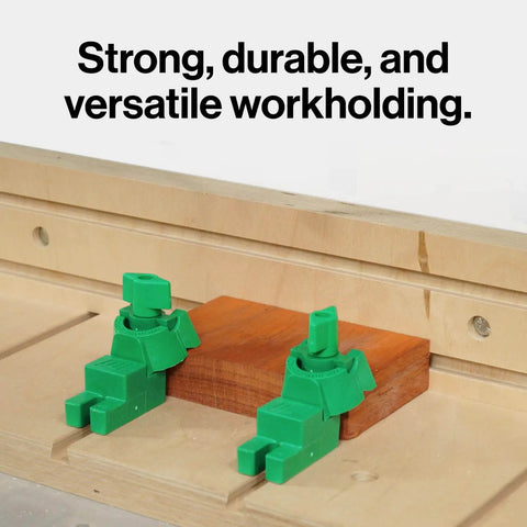 Matchfit U-Pad Low Profile Clamp System securing wood on a dovetail track for CNC router table workholding, side view