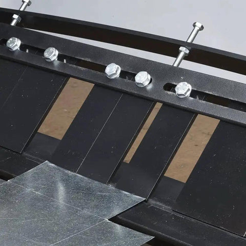 Close-up of MB48B 48 Inch Pan Style Mini Brake bending 22GA galvanized steel sheet, showing bolts and workspace details.