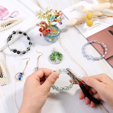 Beast Pro Grade Wire Cutters For Crafts And Jewelry Making trimming wire on a bracelet, with beads and tools visible.