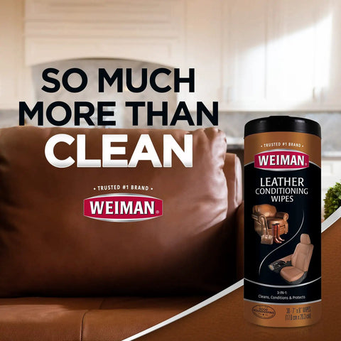 Leather Care Wipes With Microfiber Cloth For Quick Easy Cleaning Conditioning And UV Protection To Keep Leather From Cracking Or Fading On Couches Car Seats Shoes Weiman 2 Pack displayed next to a brown leather couch.