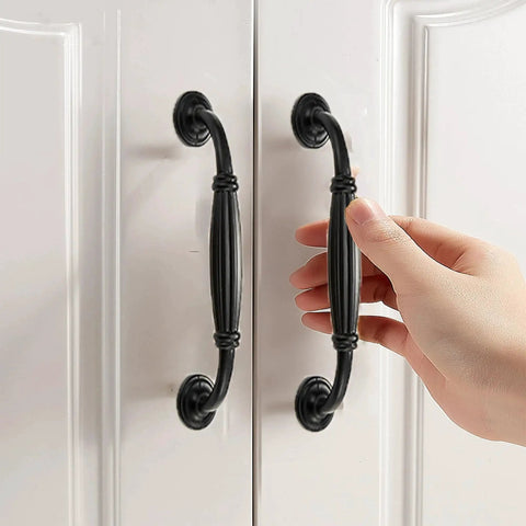 Matte Black Aluminum Alloy 10-Piece Drawer Handles Set For Kitchen Cabinets And Drawers, antique style pulls installed on white doors.