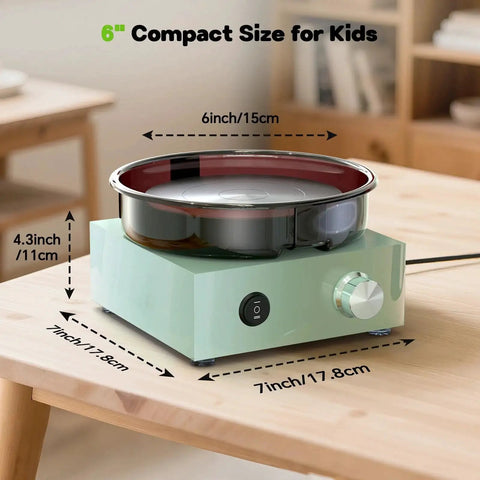 Mini Pottery Wheel Kit With 6 Inch Turntable Two Way Rotation Metal Frame And Removable Splash Tray on table for kids.