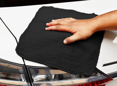 Person using Shop Towels 50 Pack Black Terry Cloth Rags For Car Detailing And Home Cleaning Beast Absorbent Reusable And Washable on car