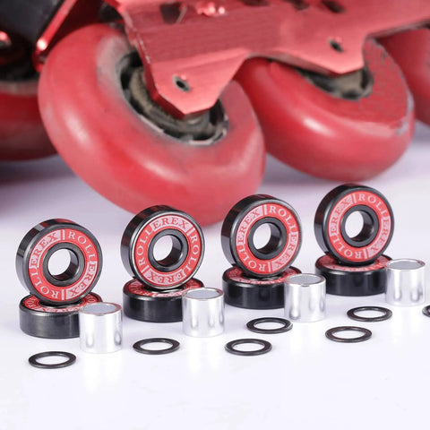 608-2RS Pre Lubricated Bearings Kit ABEC 7 with spacers and washers displayed in front of red roller skates
