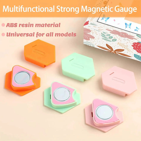 Front view of three hexagonal magnetic seam guides for sewing machines in orange, mint green, and pink with visible magnets