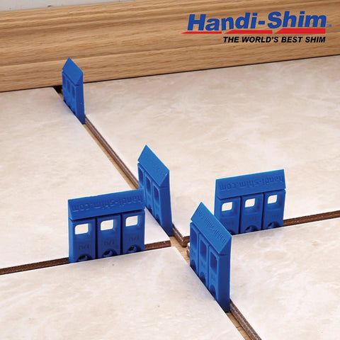Heavy Duty Reusable Plastic Construction Shims For Spacing And Leveling Great For DIY Projects And Plumbing 40 Piece Pack One Eighth Inch White Handi Shim arranged on tiled floor.