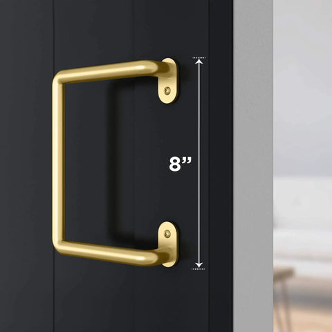 Troy Pull Handle N700-105 For Interior Sliding Barn Doors 8 Inch Brushed Gold Finish installed on a wood door.