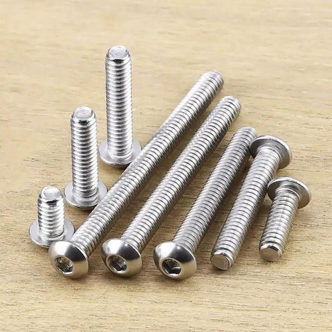 1/4-20 x 1 Button Head Socket Cap Screws In 304 Stainless Steel 18-8 With Bright Finish Allen Hex Drive Fully Machine Thread Pack Of 25 Heavy Duty Hardware For Auto Gear And DIY Projects. Screws arranged on wooden surface