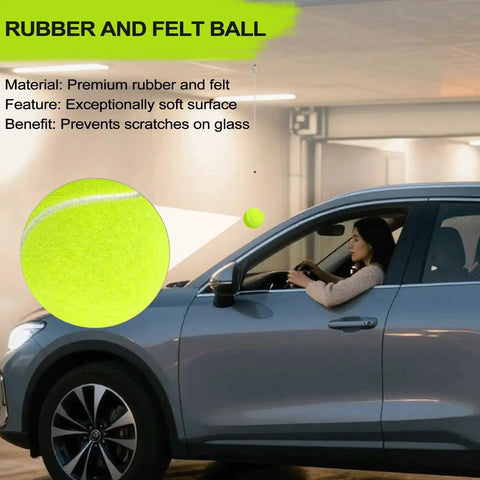 Dnairtly garage parking aid with neon green tennis-ball hanging from ceiling beside a car.
