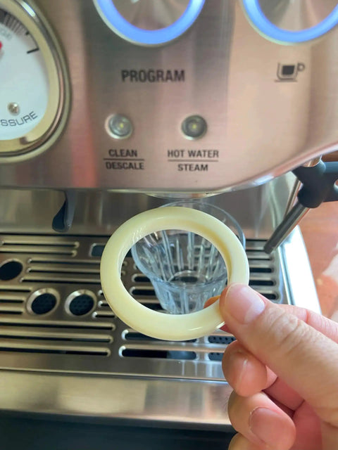 Hand holding 54 Millimeter Silicone Gasket Sealing Ring Compatible With Breville And Sage Espresso Machines 870 878 880