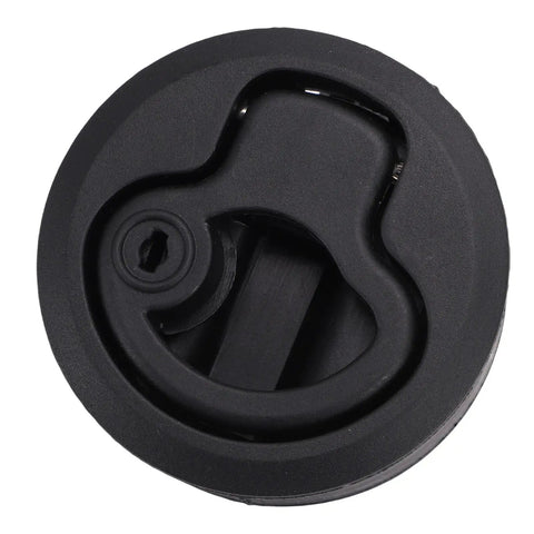 Close-up of black flush-mount round boat hatch latch with locking lever and keyhole