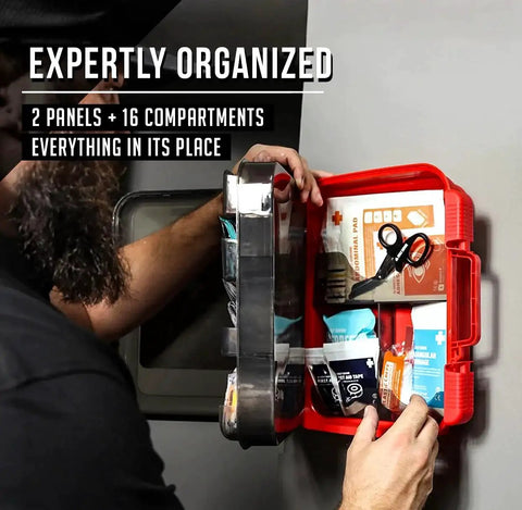 Person organizing the Comprehensive 400 Piece OSHA ANSI First Aid Kit Type III Class A Medical Supply in red case