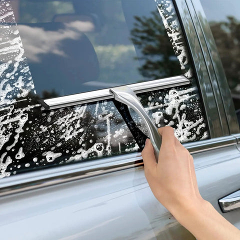 Person using Stainless Steel Shower Squeegee 10 Inch With Adhesive Hooks For Glass on a car window with soap.