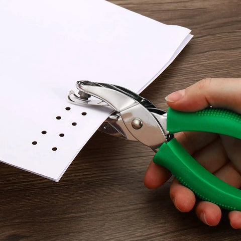 Hand using Green 3mm Round Hole Punch Handheld Paper Puncher With Soft Grip Non Slip Removable Handle for DIY crafts and paper projects