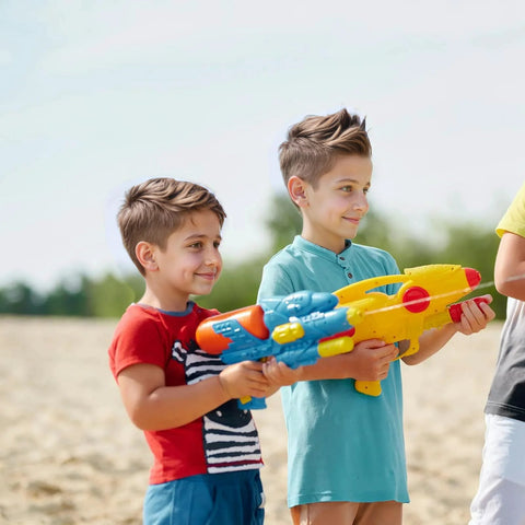 Toy water gun, large yellow and blue plastic blaster held by three kids outdoors.