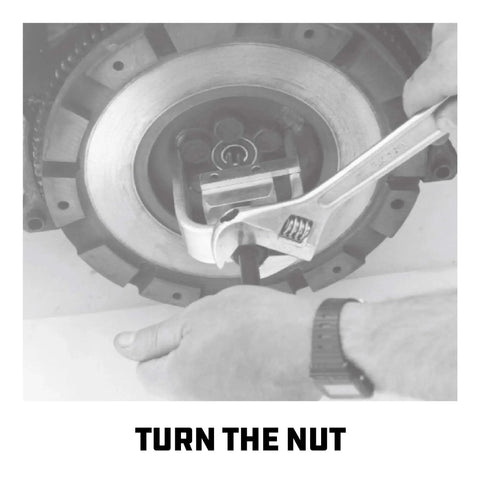 Mechanic using wrench on pilot bearing and bushing puller for flywheels and clutch replacement with deep reach fingers heavy duty removal tool