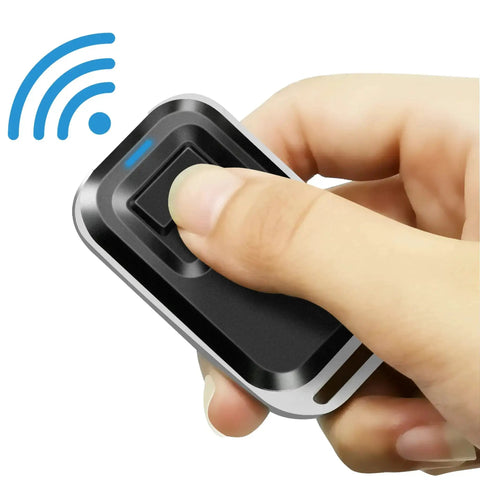 Hand holding remote control from 130Lb Magnetic Door Lock With Remote Control Kit For Drawer Cabinet Cupboard Locker Wardrobe