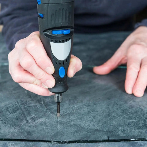Person using Five Piece Dry Diamond Drill Bit Set For Masonry And Tile With 6mm Core Bits And One Quarter Inch Diameter Vacuum Brazed