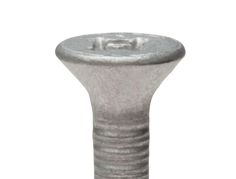 Close-up of the flat Phillips head of One Quarter Inch By Two And Three Quarters Inch Self Tapping Tapcon Concrete Screw In 410 Stainless Steel