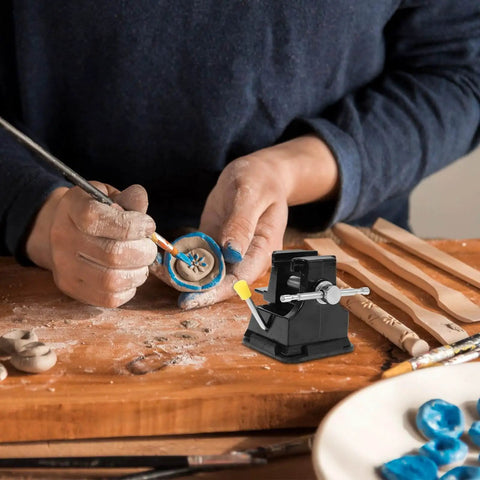 Tiny Bench Vise With Suction Base For Portable Table Mount used in jewelry making on a wooden table.