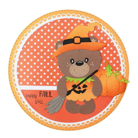 Cute bear dressed as a witch with pumpkin background, using 12pc Nesting Round Frame Die Cut Set for Cards and Scrapbooking.