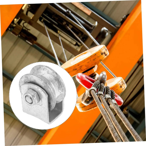 Beefy Heavy Duty Cast Iron V Groove Wheel Pulley for Sliding Gates and Garage Doors in industrial lifting setup