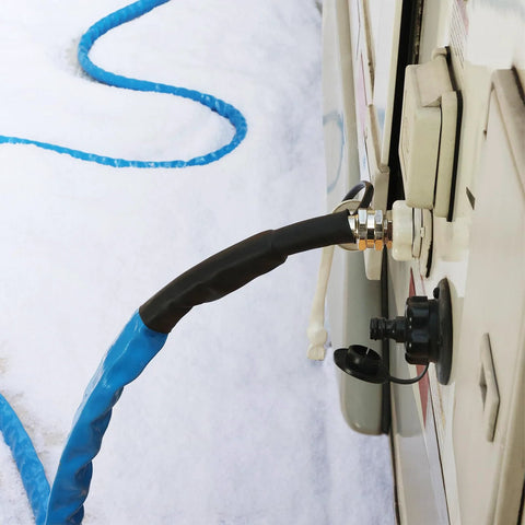 RVMATE heated RV water hose, 35 ft, blue exterior with black insulated section, connected to RV inlet